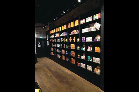 The store's interior creates a sharp contrast with the bright packaging